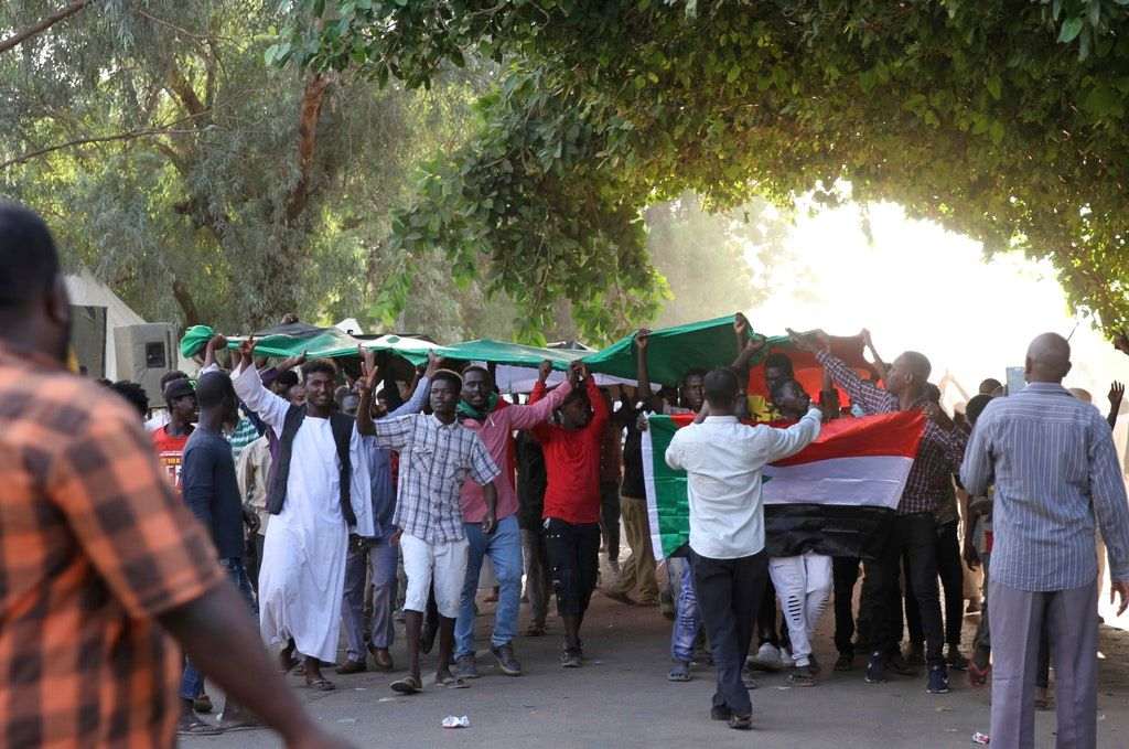Sudan PM held in apparent coup; general declares emergency